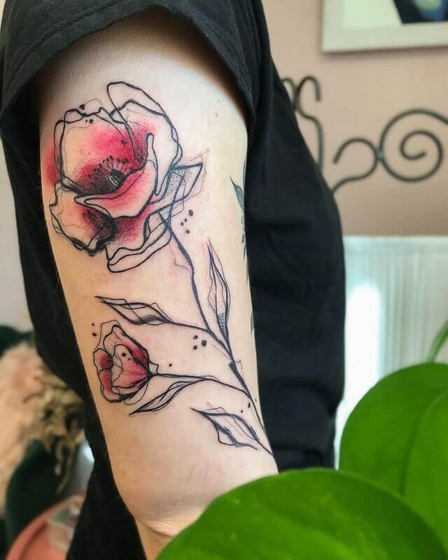 Conception de tatouage de fleur de pavot esquissée sur l'avant-bras